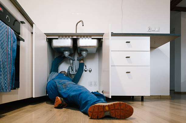Professional Drain Cleaning technician working in Clive, IA